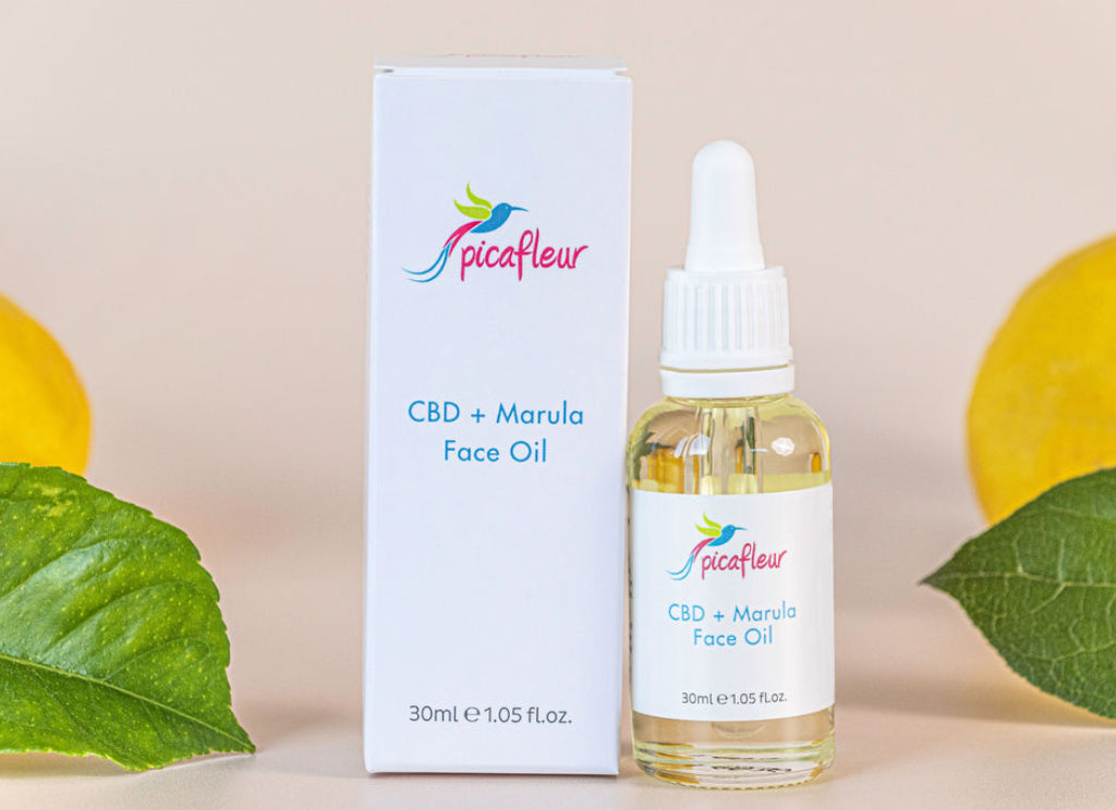 CBD and Marula Face Oil displayed with lemons to portray Vitamin C and Vitamin E