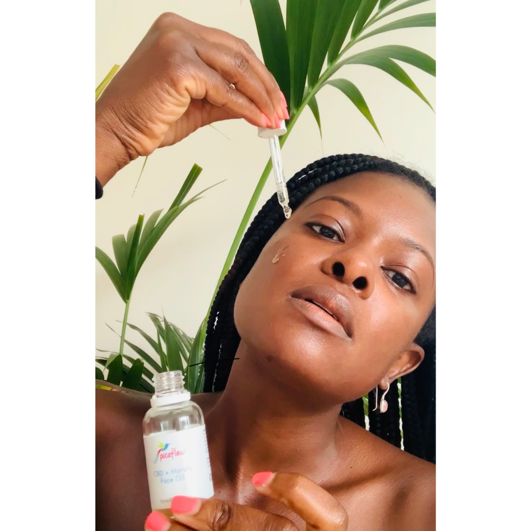 CBD and Marula face oil applied to beautiful black woman
