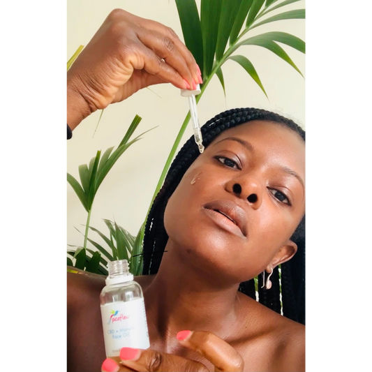 CBD and Marula face oil applied to beautiful black woman